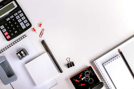 office workplace, calculator and office supplies on the table top viewの写真素材