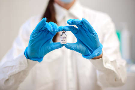 Close-up view of the vaccine in the hands of a doctor, vaccination against covid-19, medical concept