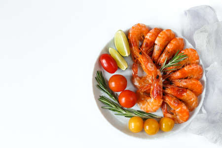 barbecue shrimp in a plate with herbs and vegetables, fried shrimp with lime, Restaurant menu,...