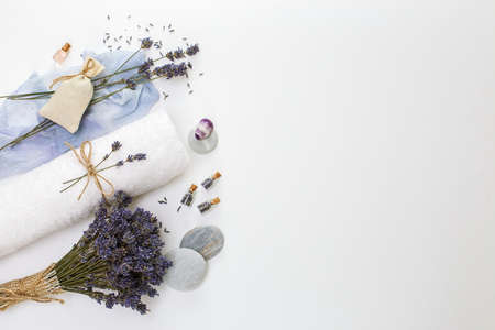 Spa concept, towel, dry lavender, on a white background with a copy of the spaceの写真素材