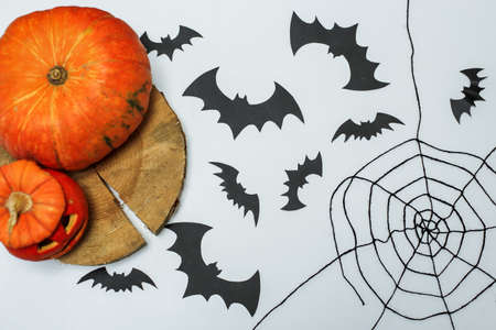 Halloween decor elements. Halloween pumpkins with candles, cobwebs, bats on a purple background. The layout of the poster for Halloweenの写真素材