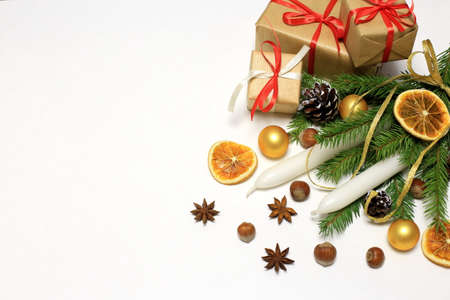 happy new year. Christmas concept. composition with spruce paws, candles and gifts on a white background, horizontal position with space for textの写真素材