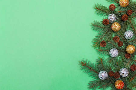 Christmas composition of fir branches, pine cones, Christmas toys and decorations with space for...