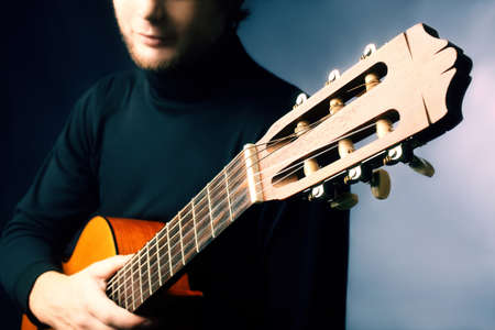 Acoustic guitar guitarist. Musical instrument with performer hand
