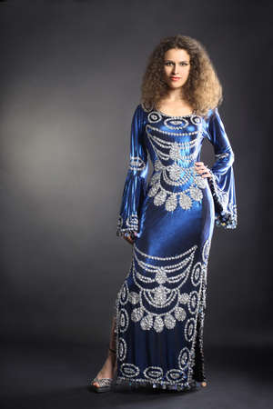 Fashion model in elegant dress. Woman portrait in Egyptian style clothes