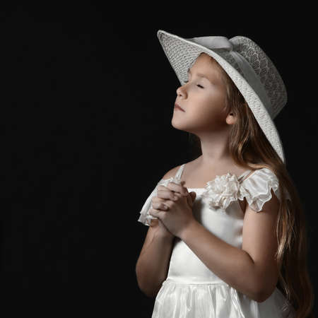 Dreamy romantic child girl in white dress and hat. Pretty sensitive girl 10 years old.の写真素材