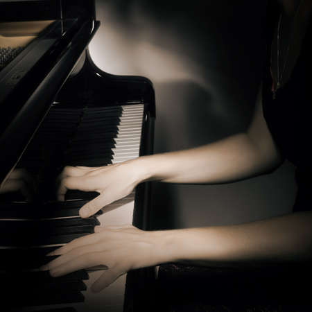 Piano hands playing pianist closeup