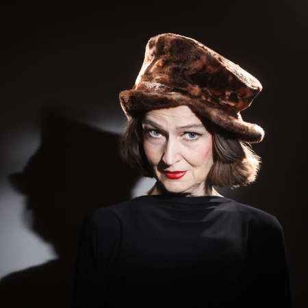 Senior woman in winter hat fashion portrait  Stylish mature lady 60 years oldの写真素材