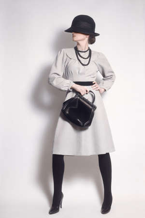 Fashion model in vintage dress Elegant woman Retro clothes styleの写真素材