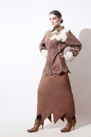 Winter clothes fashion model in long skirt and Sheepskin coatの写真素材