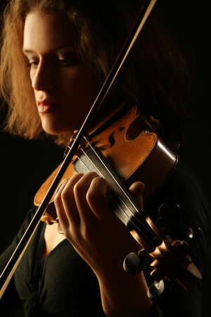 Violin player Violinist playing classical music closeupの写真素材