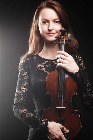 Portrait of beautiful woman with violin Player violinistの写真素材