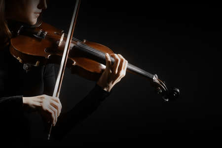 Violin player violinist hands closeup musical instrumentsの写真素材