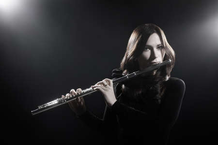 Flute player flutist playing music instrument classical musicianの写真素材