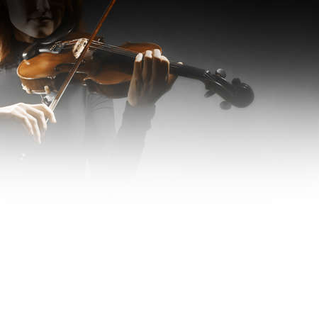 Violin player violinist playing classical music. Orchestra musical instrumentsの写真素材