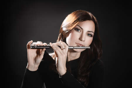 Flute piccolo flutist playing flute music instrumentの写真素材