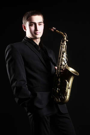 Saxophone player Saxophonist with sax alto jazz musicの写真素材