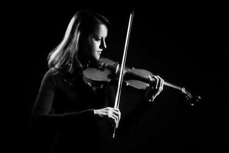 Violin player violinist playing classical music. Orchestra musical instrumentsの写真素材
