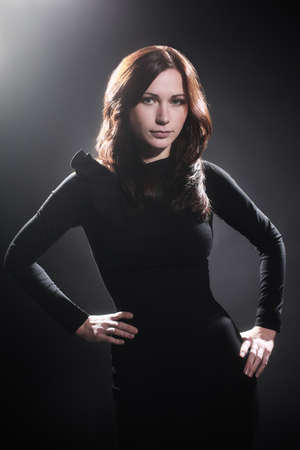 Elegant woman in black dress fashion model portraitの写真素材