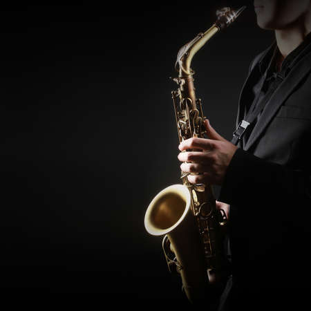 Saxophone Player Saxophonist jazz man with Sax alto Jazz Musician hands closeupの写真素材