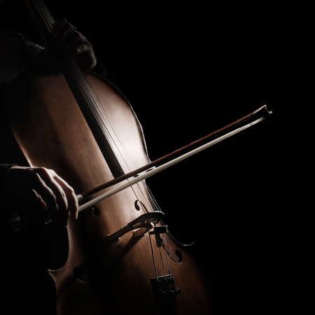 Cello player cellist playing violoncello. Musical instruments closeup isolatedの写真素材