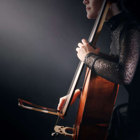 Cello player cellist playing violoncello. Musical instruments hands closeupの写真素材