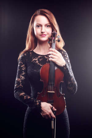 Beautiful portrait of woman violin player Classical musicianの写真素材