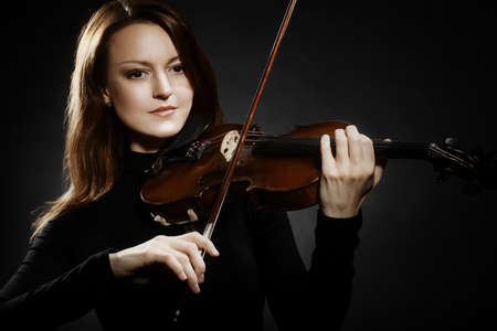 Violin player violinist classical musician playing musical instrumentの写真素材