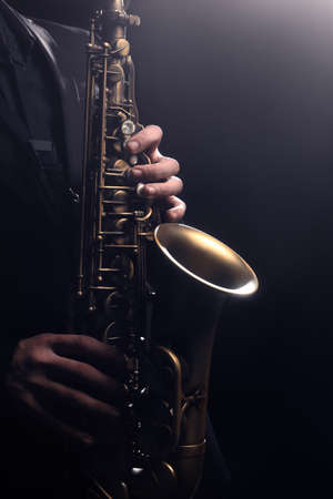 Saxophone player Saxophonist playing jazz music instrument sax alto Jazz musician hands closeupの写真素材
