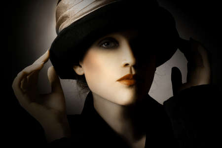 Retro woman in hat vintage portrait. Elegant lady in hat fashion styleの写真素材