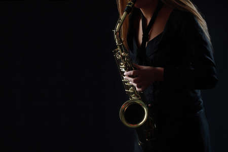 Saxophone Player Saxophonist playing jazz music. Sax alto Jazz Musician hands closeupの写真素材