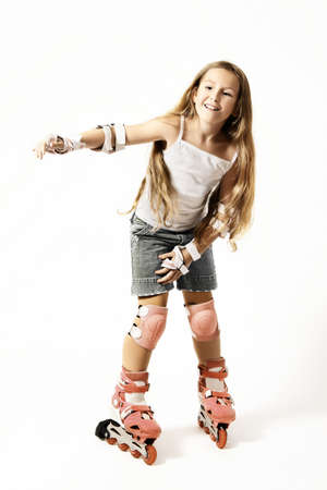 Roller skating Child girl roller skater with rollerblade isolated on white. Rollerbladerの写真素材
