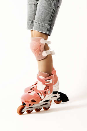 Roller skating. Roller skater legs in rollerblade isolated on white. Rollerbladerの写真素材