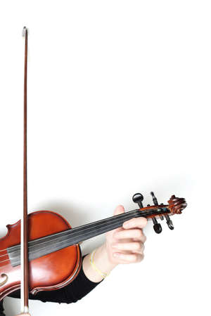 Violin bow isolated on white background. Violin player hands close upの写真素材