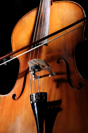 Cello player Cellist hands playing cello with bow orchestra musical instrumentsの写真素材
