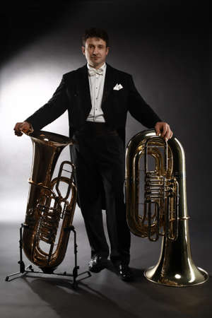 Tuba brass instrument. Classical musician portrait man horn player. Orchestra instrument bass...