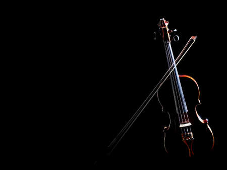 Violin with bow Classical music instruments of orchestra. Violin isolated on black backgroundの写真素材