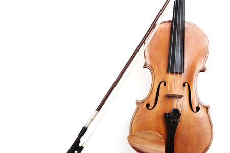 Violin closeup isolated on white background. String orchestra music instrument close up.の写真素材