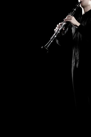 Clarinet player hands playing woodwind instrument. Orchestra music wind instruments close upの写真素材