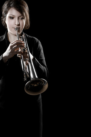 Trumpet player. Woman playing jazz trumpet. Brass musical instrument. Jazz playerの写真素材