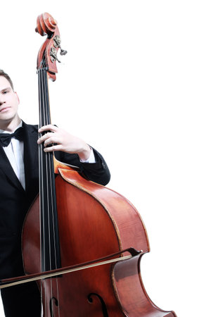 Double bass player playing contrabass with bow. Classical musician close upの写真素材