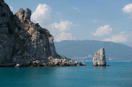 Rock in the sea  Summer, the blue sea, a separate rock in the sea about the coast の写真素材