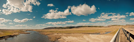 Panorama a landscape at the bridge.Kind on small small river in spring flood.の写真素材