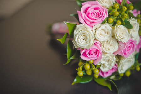 Bouquet from roses and other flowers on a table.の写真素材