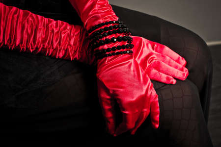 Clothes details in the form of gloves and a bracelet from a beads. の写真素材