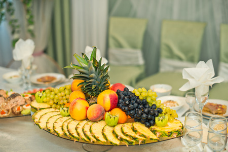 Table with the spread-out devices and food.