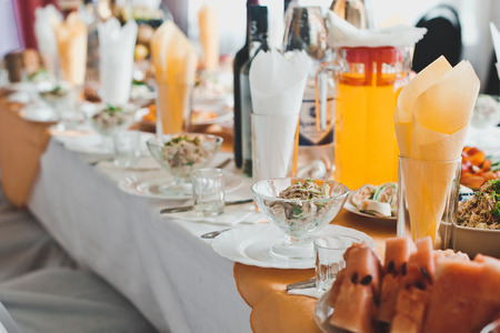 The table ready for carrying out a holiday with established dishes.の写真素材