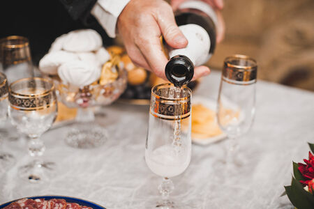 Congratulation on the glasses filled with wine.