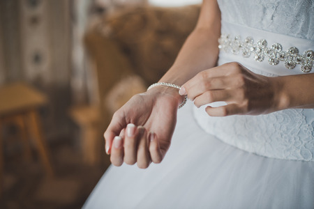 Process of clothing of a bracelet on a hand of the bride.の写真素材