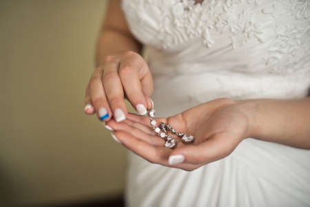 The young woman holds ornaments which is going to put on wedding.の写真素材
